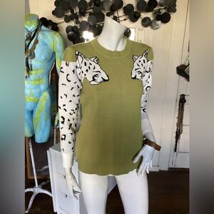 Fantastic  cheetah on sleeve and green sweater